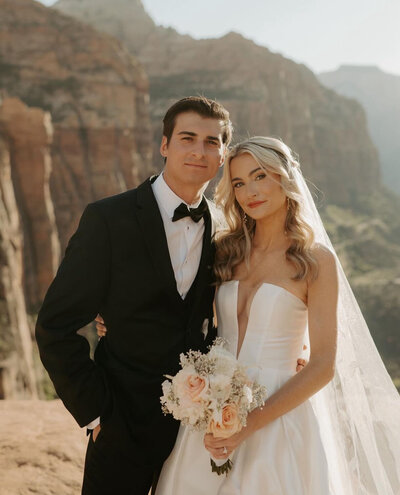 Bride in desert landscape with loose waves by Las Vegas bridal hair stylist Makall