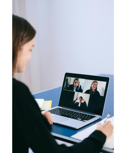 A person on the computer on a video call