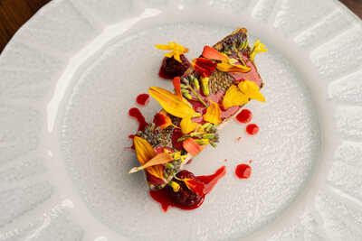 Seasonal tasting menu dish beautifully plated at Revé in Niagara-on-the-Lake