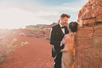 bride and groom embrace after desert elopement in las vegas