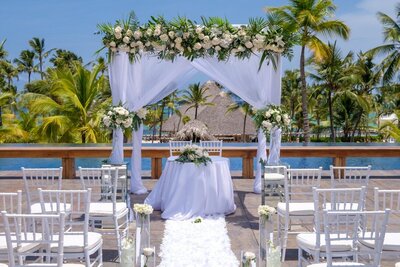 Outdoor wedding ceremony site with floral details