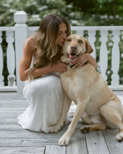 Bride kisses dog at black tie wedding in North Carolina