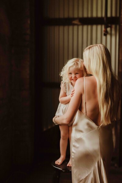 Warehouse photography session with mother and child