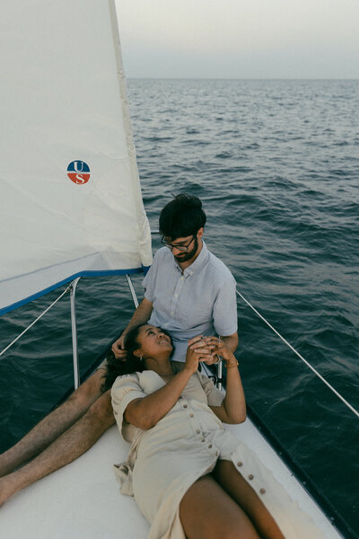 couple embracing on boat engagement session