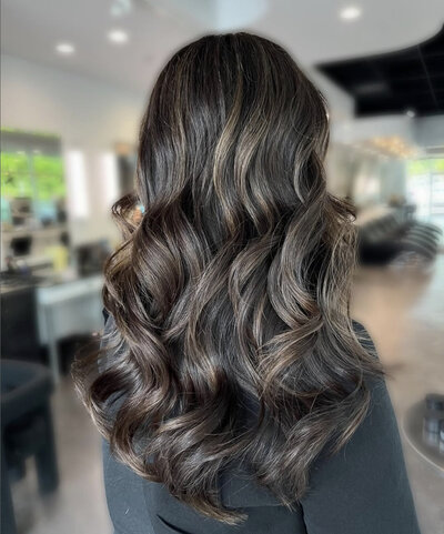 Vivid client with newly coloured long, brunette hair