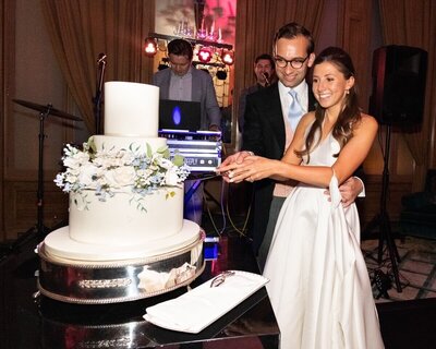 A picture of Rebecca & Fred cutting thier cake