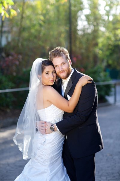 Bride and Groom hugging at their portraits in Japanese Friendship Gardens in Balboa Park Wedding Venue