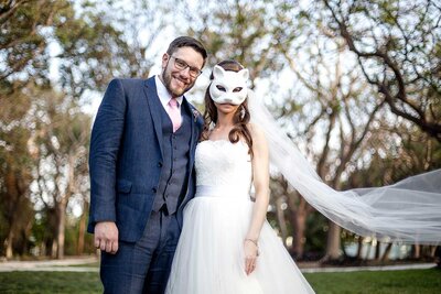 Bride wearing a cat mask and Groom on their Wedding Day in Central Florida