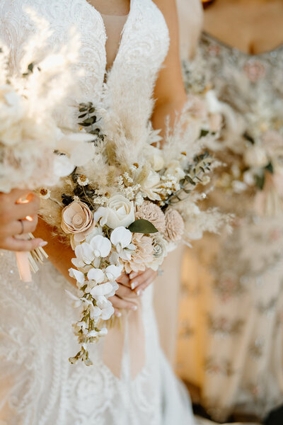 bride holding bouquet at her side