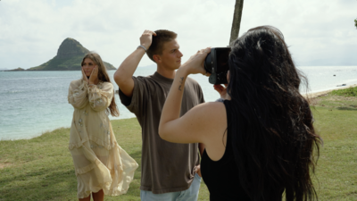 photographer taking picture of bride and groom