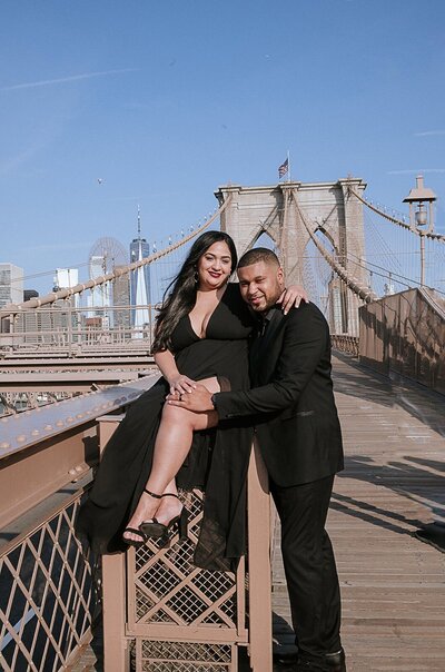 Elegant inter-racial couple looking at each other during cake cutting.