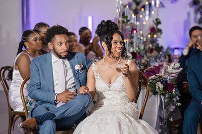 Happy bride and groom enjoying their wedding reception, planned by a luxury wedding coordinator.