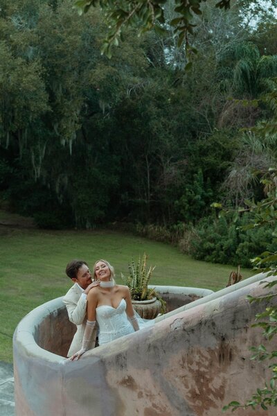 Bride and groom at The Howey Mansion in Florida—capturing romance and elegance at a historic wedding venue with stunning architecture, planned by Watters & Co. Events.