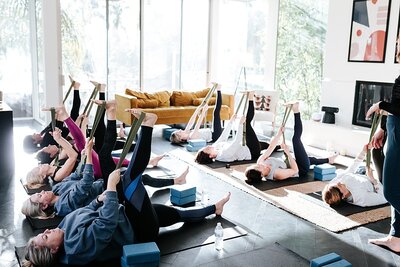 group of female photographers doing yoga at an in person retreat