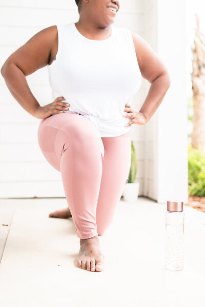 Woman in yoga clothes streching
