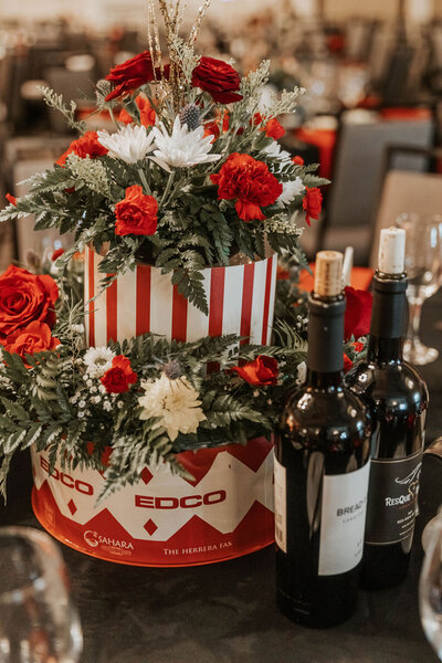 Circus themed floral arrangements and wine bottles at a party planned by Fancy Chancey in San Diego CA