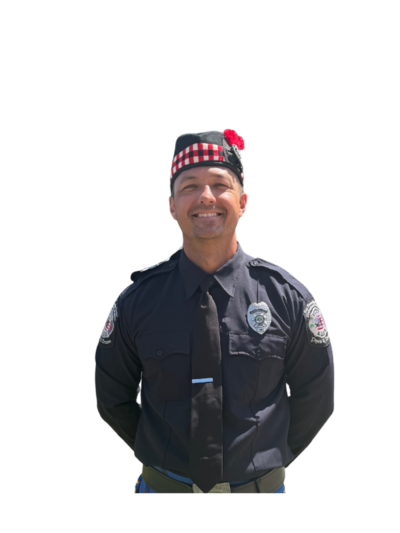 Chris Snape, Band Manager of Local 935 Pipes and Drums, holding it together with a grin (barely).