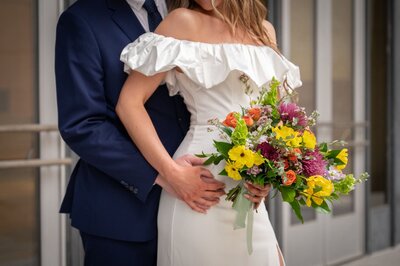 book centerpiece with two orange flowers