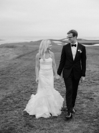 Bride and Groom walk with wedding party in Charleston