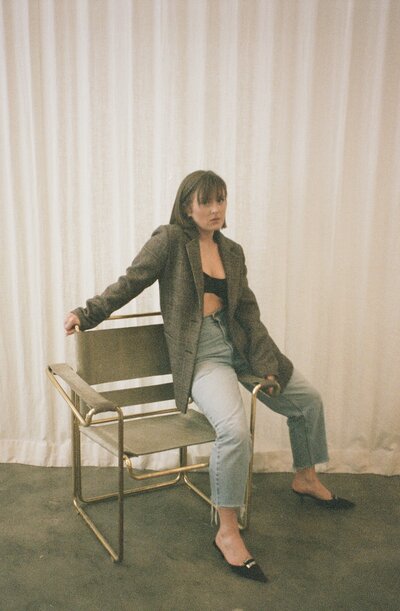 woman posing sitting on a chair