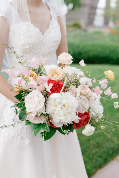 Bride at her wedding processional, carrying her bridal bouquet