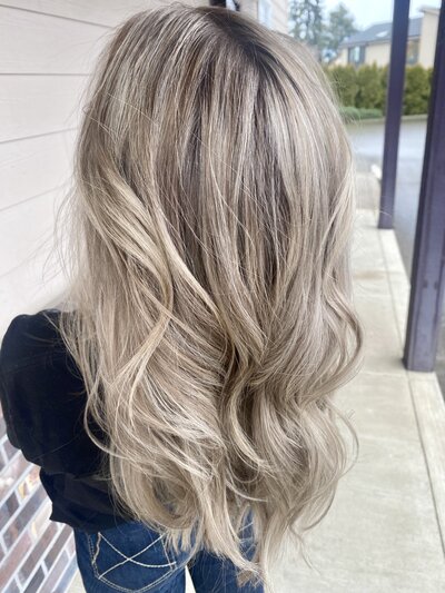 Close-up of lived-in blonde waves, showcasing Maven + Grace’s signature color work and attention to hair health.