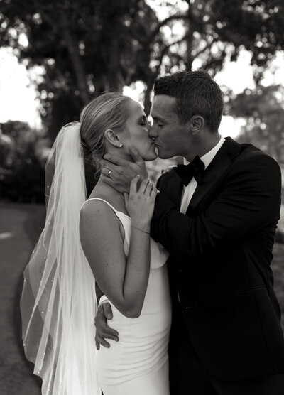 bride and groom kissing