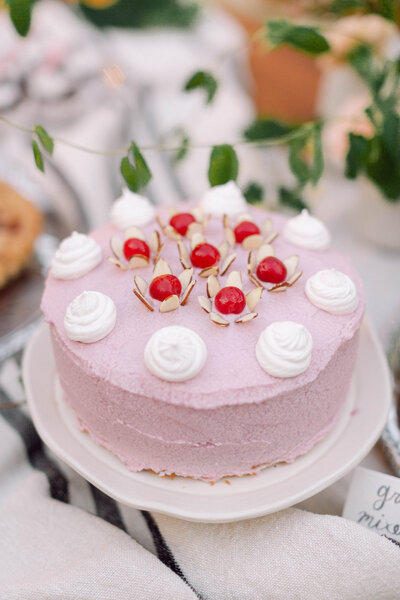wedding cake with floral accents at a backyard reception in Richmond.​
