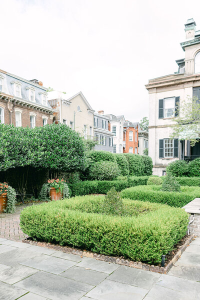 A beautiful garden view of Harper Fowlkes House, a historic and elegant wedding venue in Savannah, Georgia. This timeless setting offers Southern charm and sophistication for intimate wedding celebrations. Captured by Amia Marcell destination Photographer.