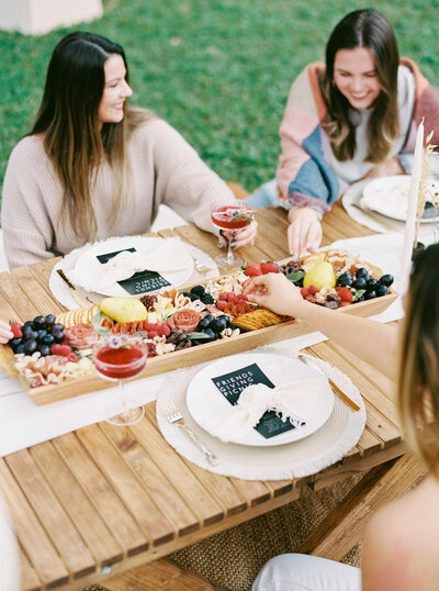 Friends at Picnic with Charcuterie Board