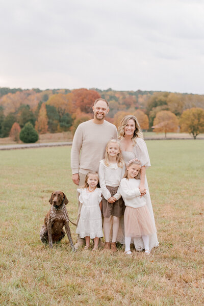 Family posing for a portrait at Joyner Park in Wake Forest NC. Image by Raleigh family photographer A.J. Dunlap Photography.