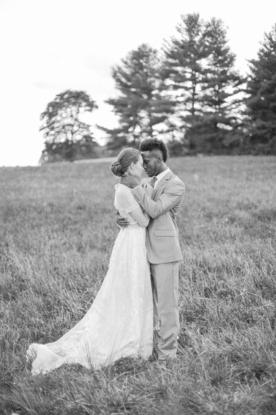 Bride and groom hold each other closely while on the property of their private estate wedding in Louisville Kentucky photographed by Lexington Kentucky wedding photographer Magnolia Tree Photo Company