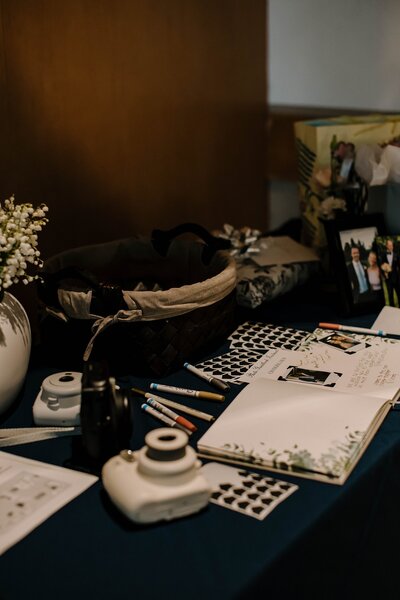 Wedding table with guestbook and polaroid camera