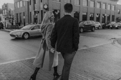 Couple walking together during their downtown Michigan session