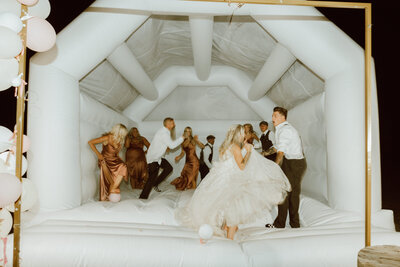 bridal party in a bounce house