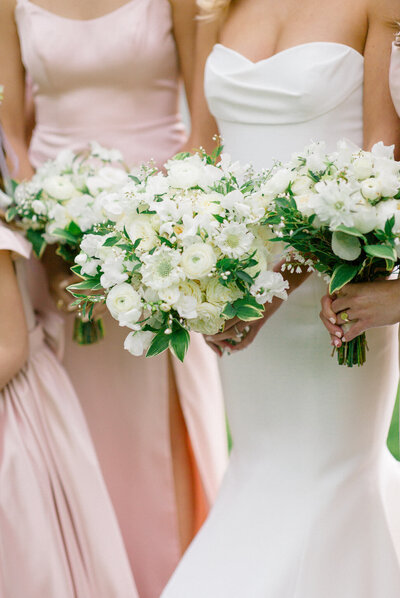 Bride and her bridesmaids and their bouquets at The Clifton in Charlottesville, Virginia.