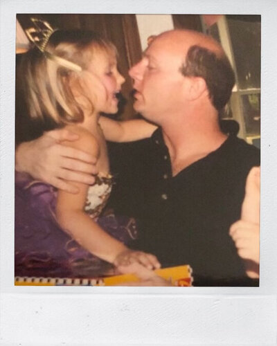 Polaroid of photographer Caroline Brackney as a child with father