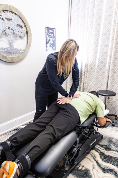 Dr. Tori adjusting an adult