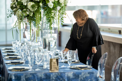 Luxury event planner in Raleigh, NC, finalizing wedding decor at a top wedding venue.