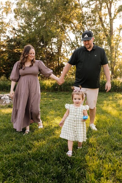 McKenna Fahrenbruch with her husband and daughter, the family team behind Graceful Exposure Media, a heart-led business offering social media marketing and videography services