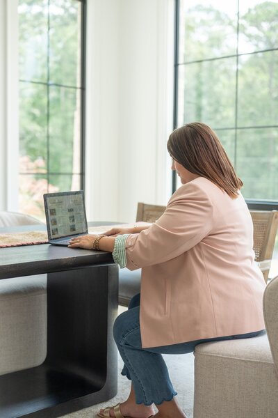 Chloe with realtor partner discussing staging plan in new listing