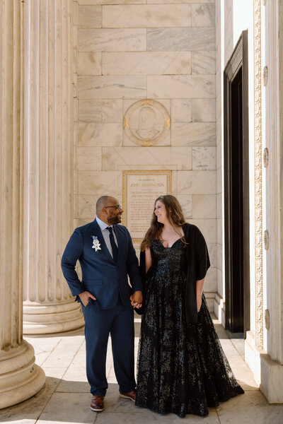 Bride and groom walking at the Cleveland Museum of Art.