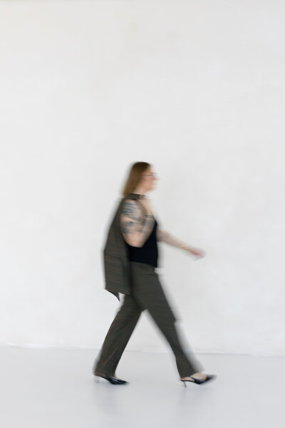 Suzy Goodrick poses for headshot in photo studio