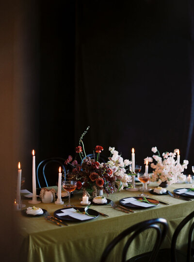 green red white and black table top with candles in los angeles