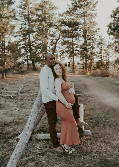 fine art image of expectant couple in the mountains of colorado