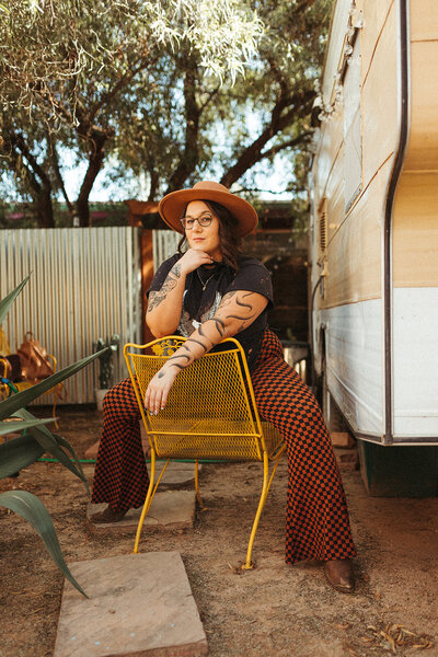 woman sitting on chair backwards