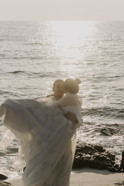 couple embracing during their prewedding photoshoot on jeju island