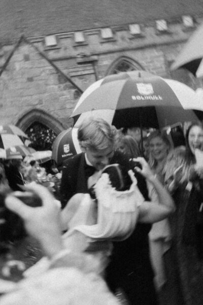 Candid editorial (clitheroe) photo of the bride smiling down while holding a bouquet, natural and honest Luis Calow storytelling.