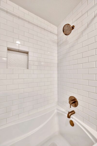Luxurious shower in this one-bedroom, one-bathroom rental condo in the historic Behrens building just blocks from the Magnolia Silos and Baylor University in downtown Waco, TX.