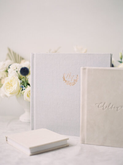 Seattle Wedding Photographers linen wedding albums with gold embossing by red tree